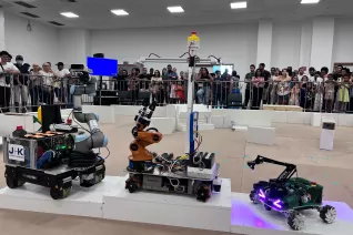RoboCup 2025 robots on RoboCup@Work podium
