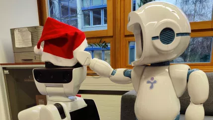 Lucy Santa and QTrobot