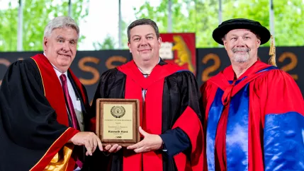 UNB Predident Paul Mazerolle (l), Kenneth Kent and UNB Vice-President David MaGee