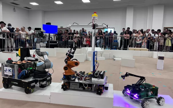 RoboCup 2025 robots on RoboCup@Work podium