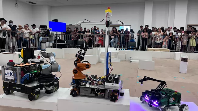 RoboCup 2025 robots on RoboCup@Work podium