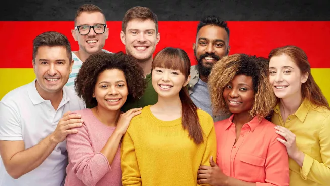 Personengruppe vor deutscher Flagge Colourbox 24347388