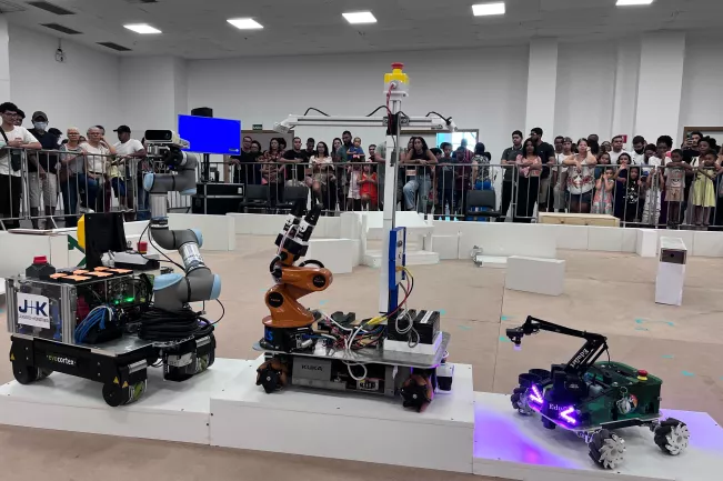 RoboCup 2025 robots on RoboCup@Work podium