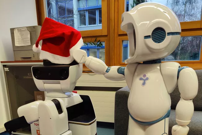 Lucy Santa and QTrobot