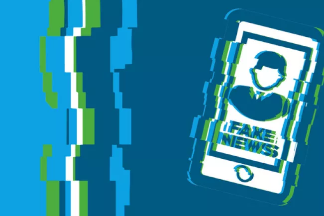 Grafik Handy mit Schriftzug Fake News